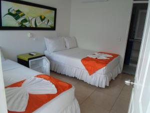 Postel nebo postele na pokoji v ubytování Hotel Zamba