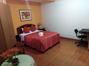 Postel nebo postele na pokoji v ubytování Hotel Suite Plaza