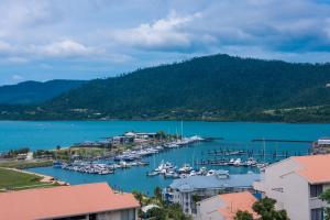 a view of a marina with boats in the water at Magnificence At Airlie in Airlie Beach