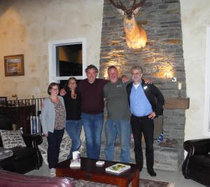 a group of people posing for a picture in a living room at Seatonwood Villas in Swannanoa