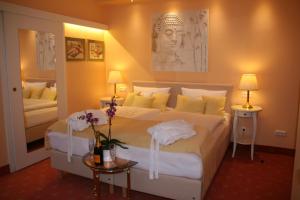 Postel nebo postele na pokoji v ubytování Hotel Modena
