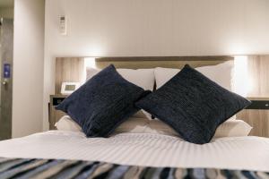 Letto o letti in una camera di Hotel Mystays Kagoshima Tenmonkan Annex