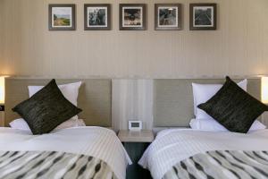 Letto o letti in una camera di Hotel Mystays Kagoshima Tenmonkan Annex