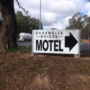 a sign that says dabbles bridge motel next to a tree at Grampians Motel /Hotel in Dadswells Bridge