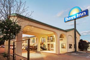 a days inn sign in front of a building at Days Inn by Wyndham Espanola in Espanola