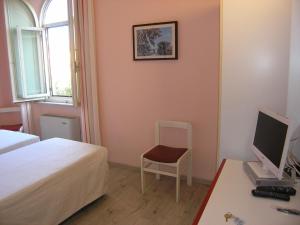 Postel nebo postele na pokoji v ubytování Elba Hotel