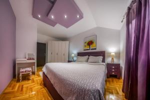 Postel nebo postele na pokoji v ubytování Apartments Danigo