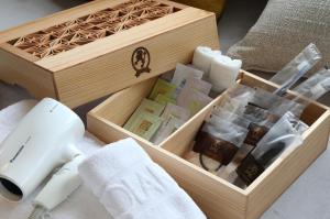 a wooden box with a set of products in it at Solaria Nishitetsu Hotel Fukuoka in Fukuoka