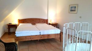 a bedroom with a bed and two night stands at Maisionette Wohnung im Hafenmeisterhaus Lauterbach in Lauterbach