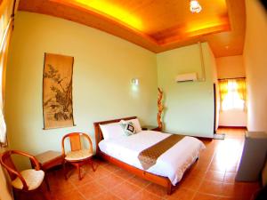 Uma cama ou camas num quarto em Jiang Shui Village B&B