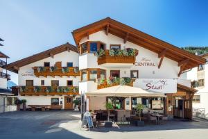 a building with an umbrella in front of it at Haus Central in Serfaus