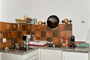 A kitchen or kitchenette at Studio in Chasa Quirin