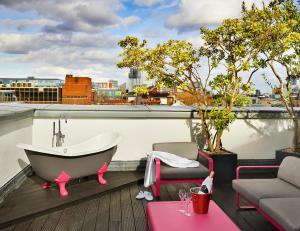 a bath tub sitting on top of a roof at The Zetter Hotel in London