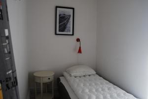 Katil atau katil-katil dalam bilik di Halmstad Hotell & Vandrarhem Kaptenshamn