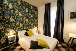 Postel nebo postele na pokoji v ubytování Arsenale Suites