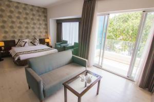 Postel nebo postele na pokoji v ubytování Ngoc Linh Luxury Hotel