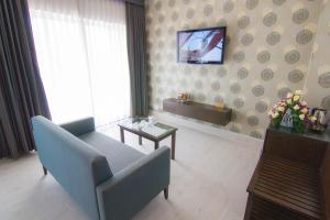 TV a/nebo společenská místnost v ubytování Ngoc Linh Luxury Hotel