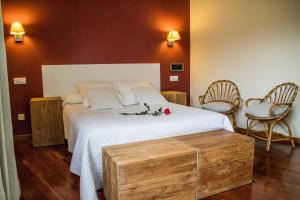 Hotel Montañas de Covadonga tesisinde bir odada yatak veya yataklar