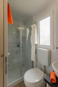 a bathroom with a shower and a toilet and a sink at Diana & Josip Mobile Homes in Biograd na Moru +62 photos