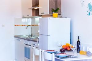 Kuchyň nebo kuchyňský kout v ubytování Apartment Yellow Story