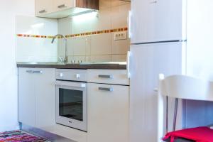 Kuchyň nebo kuchyňský kout v ubytování Apartment Yellow Story