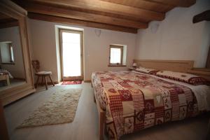 Ein Bett oder Betten in einem Zimmer der Unterkunft Albergo Diffuso Valcellina e Val Vajont in Casso