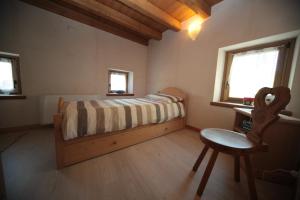 Ein Bett oder Betten in einem Zimmer der Unterkunft Albergo Diffuso Valcellina e Val Vajont in Casso