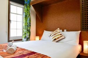 Letto o letti in una camera di Mojo Lodge Hakuba