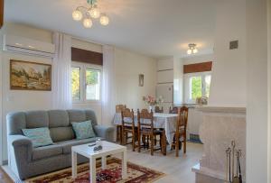a living room with a couch and a table at Casa Adofreire in Melgaço