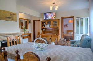 a dining room with a table with a basket on it at Casa Adofreire in Melgaço