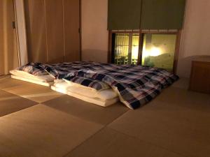 Katil atau katil-katil dalam bilik di Minpaku Momotaro Bekkan
