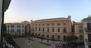 a large building in the middle of a city at Cosmopolitan B&B in Palermo