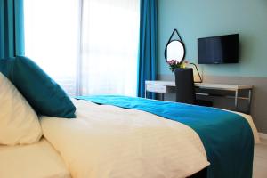 Łóżko lub łóżka w pokoju w obiekcie JessApart – Ochota Apartments