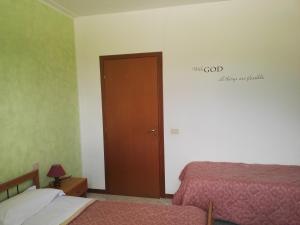 Postel nebo postele na pokoji v ubytování Camere Carloni