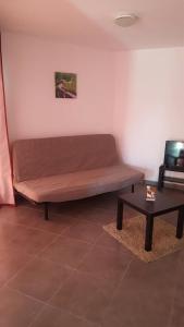 a bed in a room with a coffee table at Casas Blancas Las Tortugas in Playa de las Americas