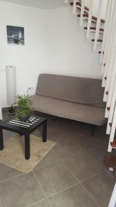 a living room with a couch and a table at Casas Blancas Las Tortugas in Playa de las Americas