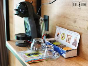 a table with glass jars and a box on it at Chotel Pham Ngu Lao in Ho Chi Minh City