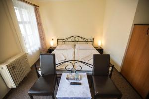 Postel nebo postele na pokoji v ubytování Hotel Jeleň