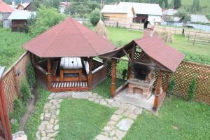 an aerial view of a small house with a roof at Pensiunea Alexandra in Vatra Moldoviţei