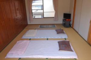 Postel nebo postele na pokoji v ubytování MaruHouse