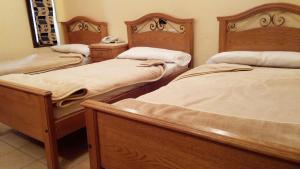 Voodi või voodid majutusasutuse Applicators Hotel toas