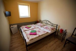 Postel nebo postele na pokoji v ubytování Hotel Jeleň