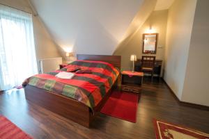 Łóżko lub łóżka w pokoju w obiekcie Janówka Apartamenty