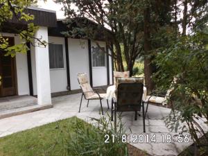 two chairs and a table on a patio at Ferienhaus Gregor in Birkenwerder