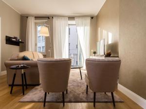 Televízia a/alebo spoločenská miestnosť v ubytovaní Milano Manzoni CLC Apartments