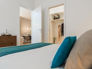 Posteľ alebo postele v izbe v ubytovaní Milano Manzoni CLC Apartments