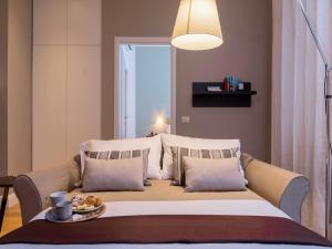 Posteľ alebo postele v izbe v ubytovaní Milano Manzoni CLC Apartments