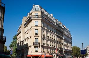 a large building on a city street with at Hotel Elysa-Luxembourg in Paris