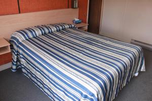 Llit o llits en una habitació de Motel Boisé
