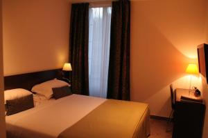 Säng eller sängar i ett rum på Hotel La Beauze